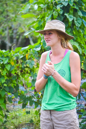 St. John explaining sustainable food systems inside Kalu Yala's permaculture forest. Photo by Grace Wade/ Medill