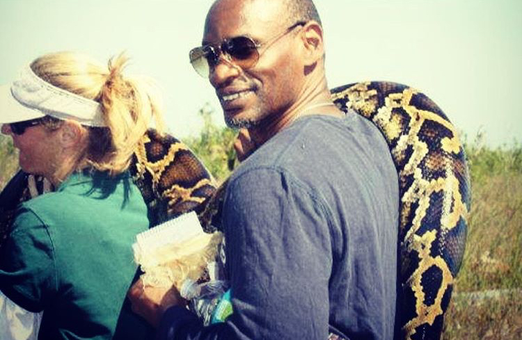 Darryl Fears carrying a snake